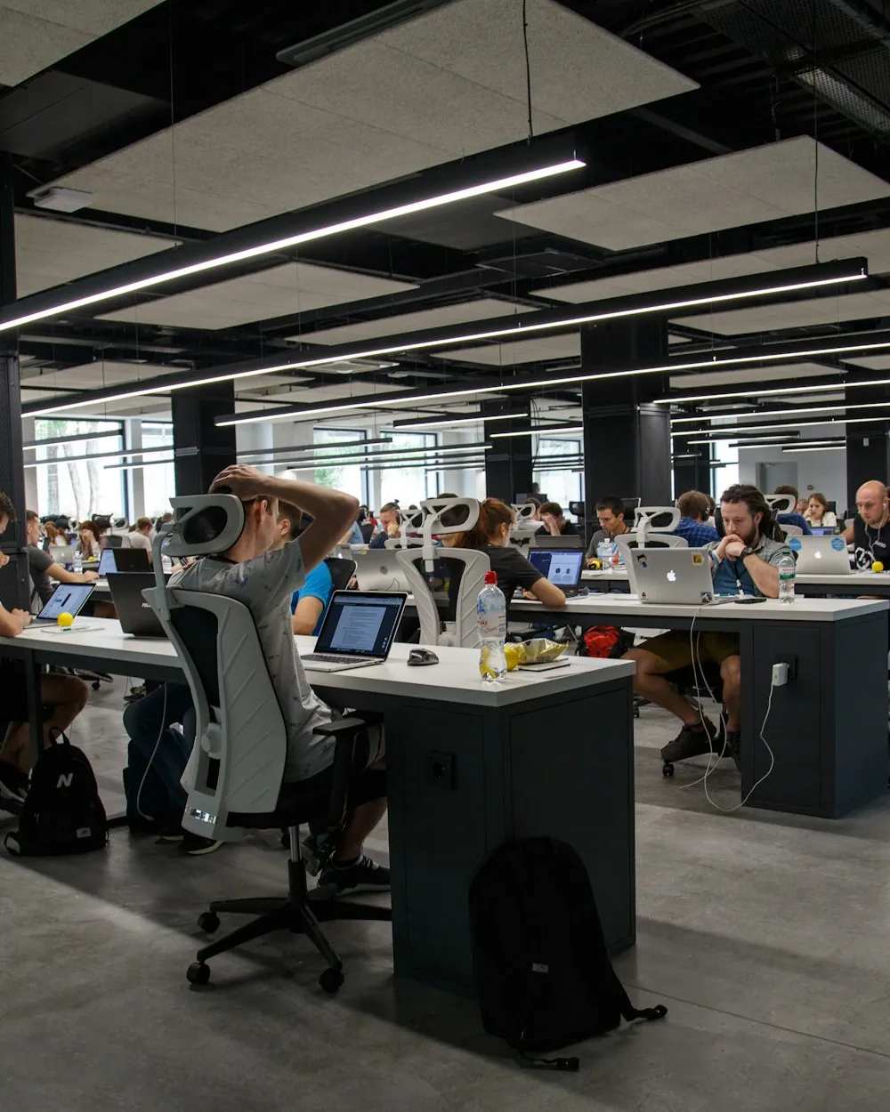 Engineers working across an open-plan office floor