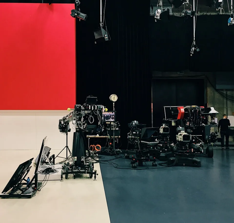 Camera rigs and lighting on a television studio floor