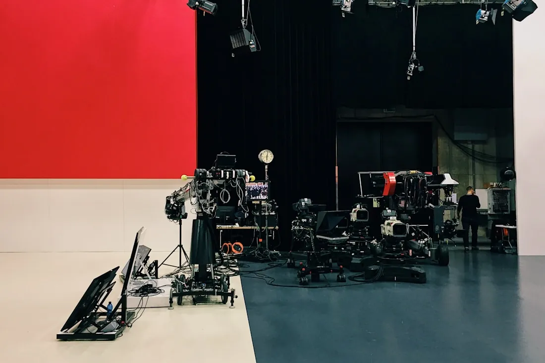 Camera rigs and lighting on a television studio floor