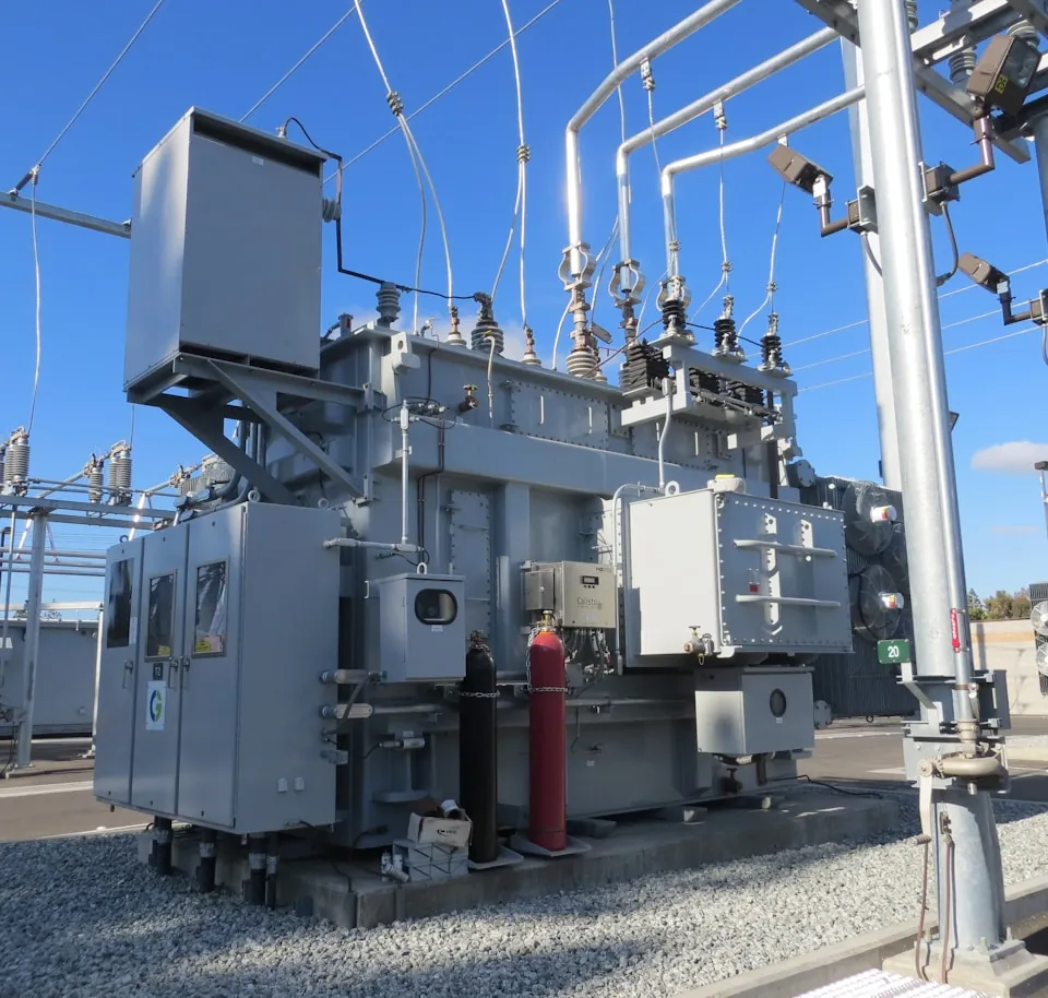 A high voltage transformer inside an electrical substation