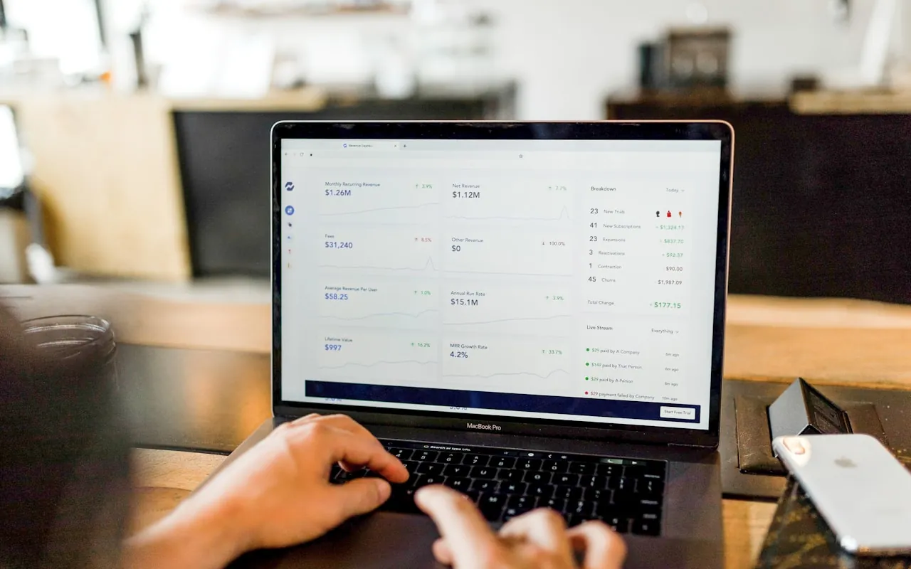 Hands working in an application interface on a laptop