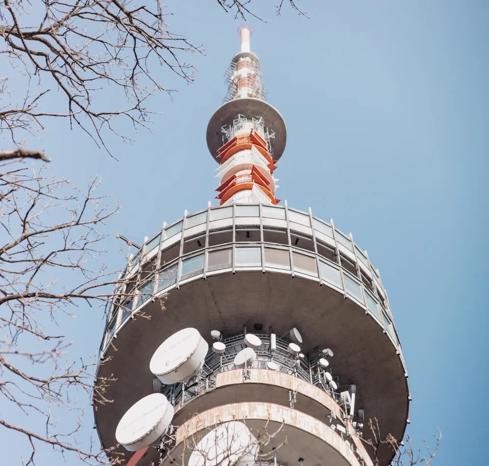 A telecommunications tower carrying microwave dishes and antennas