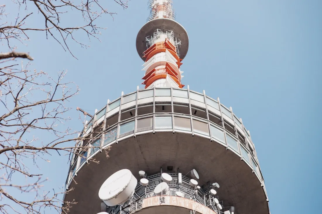 A telecommunications tower carrying microwave dishes and antennas