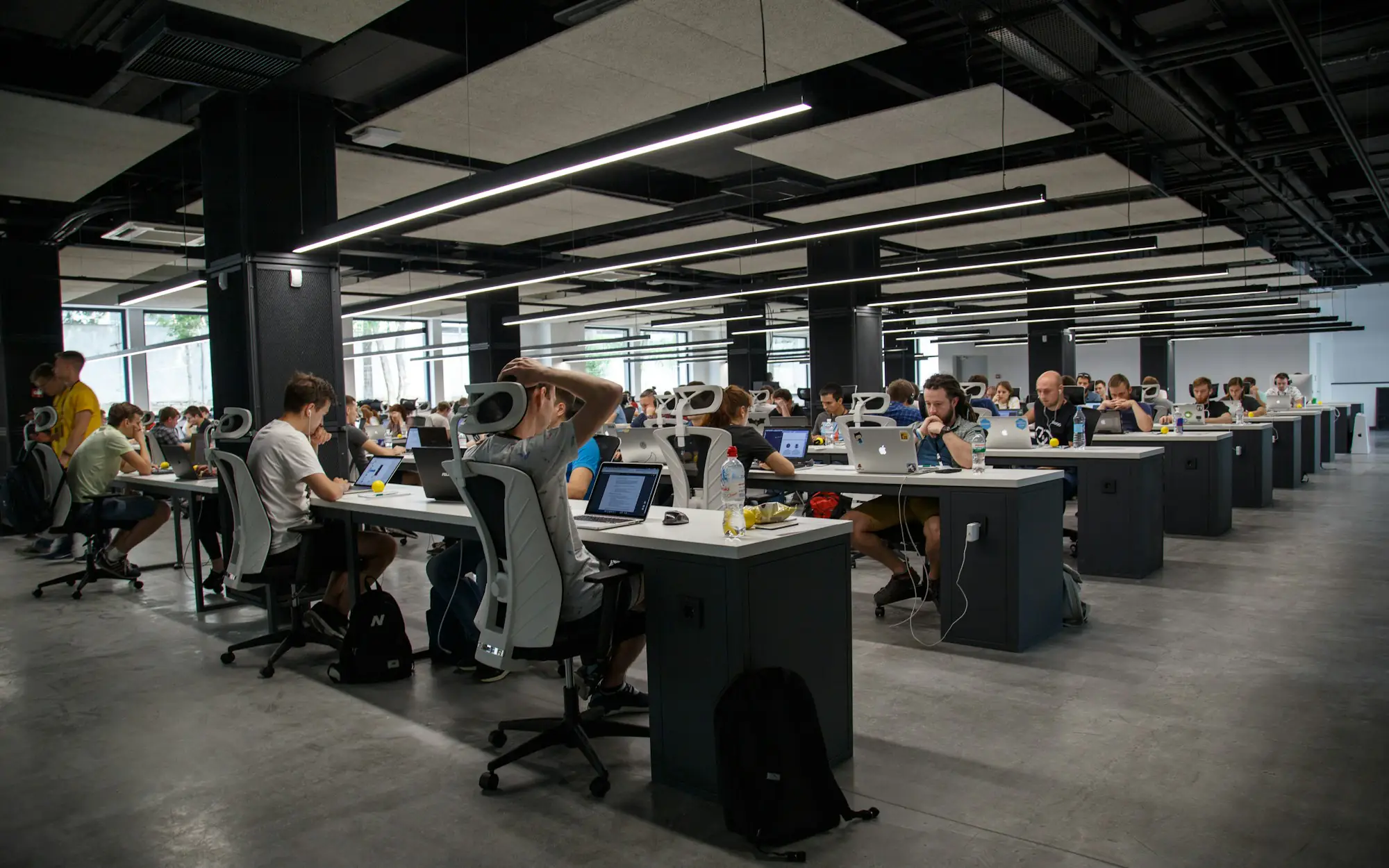 Engineers working across an open-plan office floor
