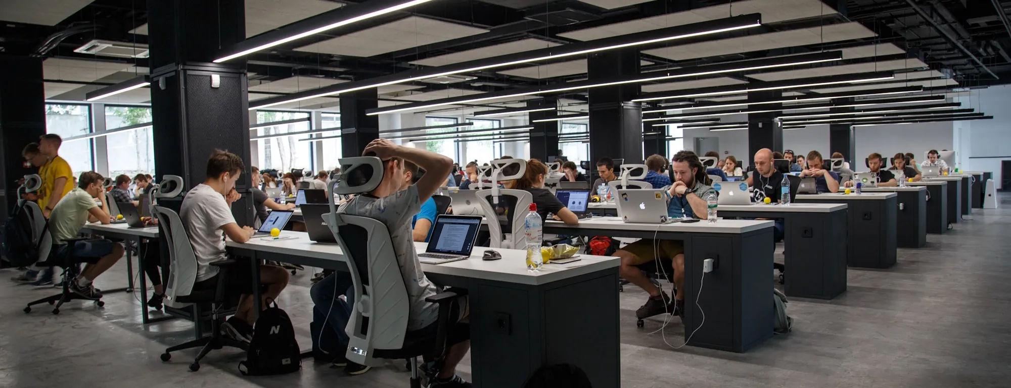 Engineers working across an open-plan office floor