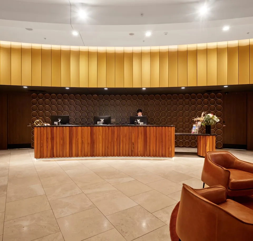 The reception desk at the front of house of a hotel